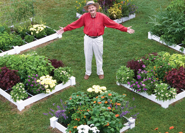 The inventor showing the square foot gardens